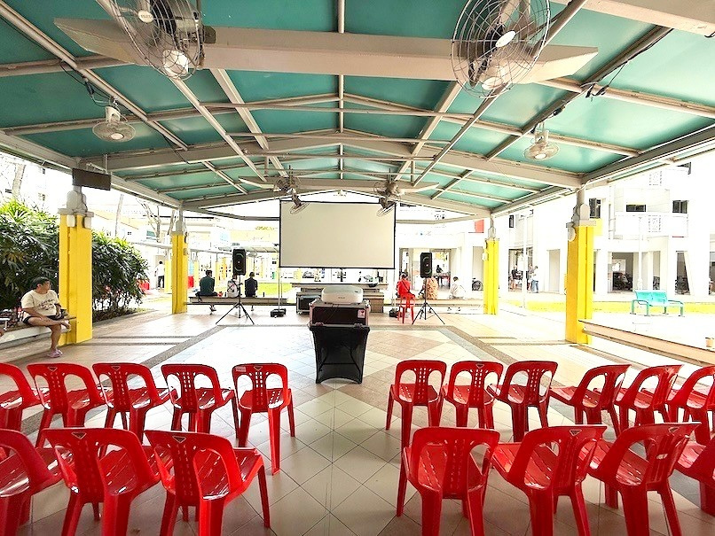 Movie Screening: 6 Easy Ways to Plan Better Seating 10 Rows of red chairs facing a community movie screen