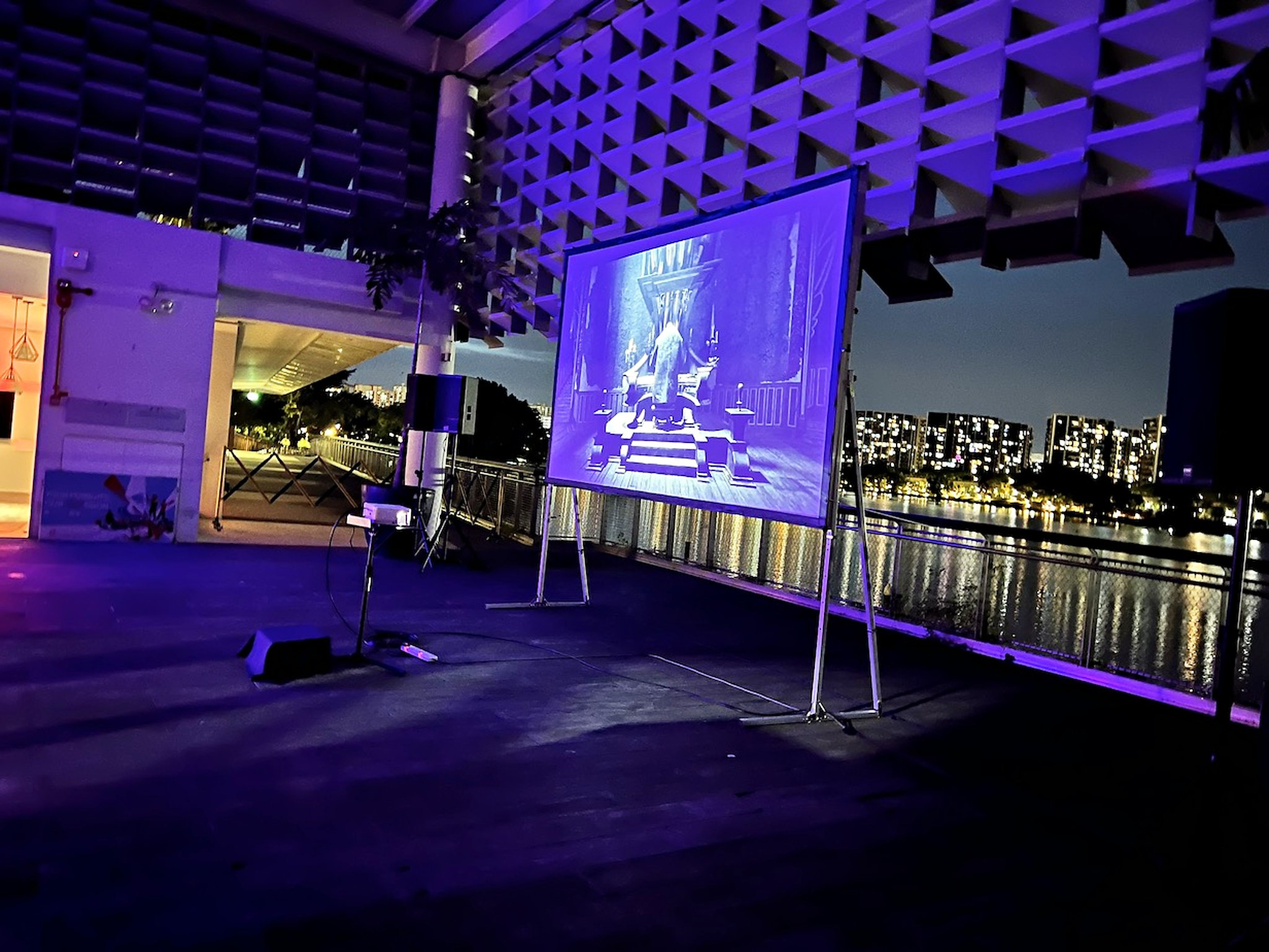 Movie Screening: 6 Easy Ways to Plan Better Seating 6 Angled view of a waterfront projection screen during an evening film