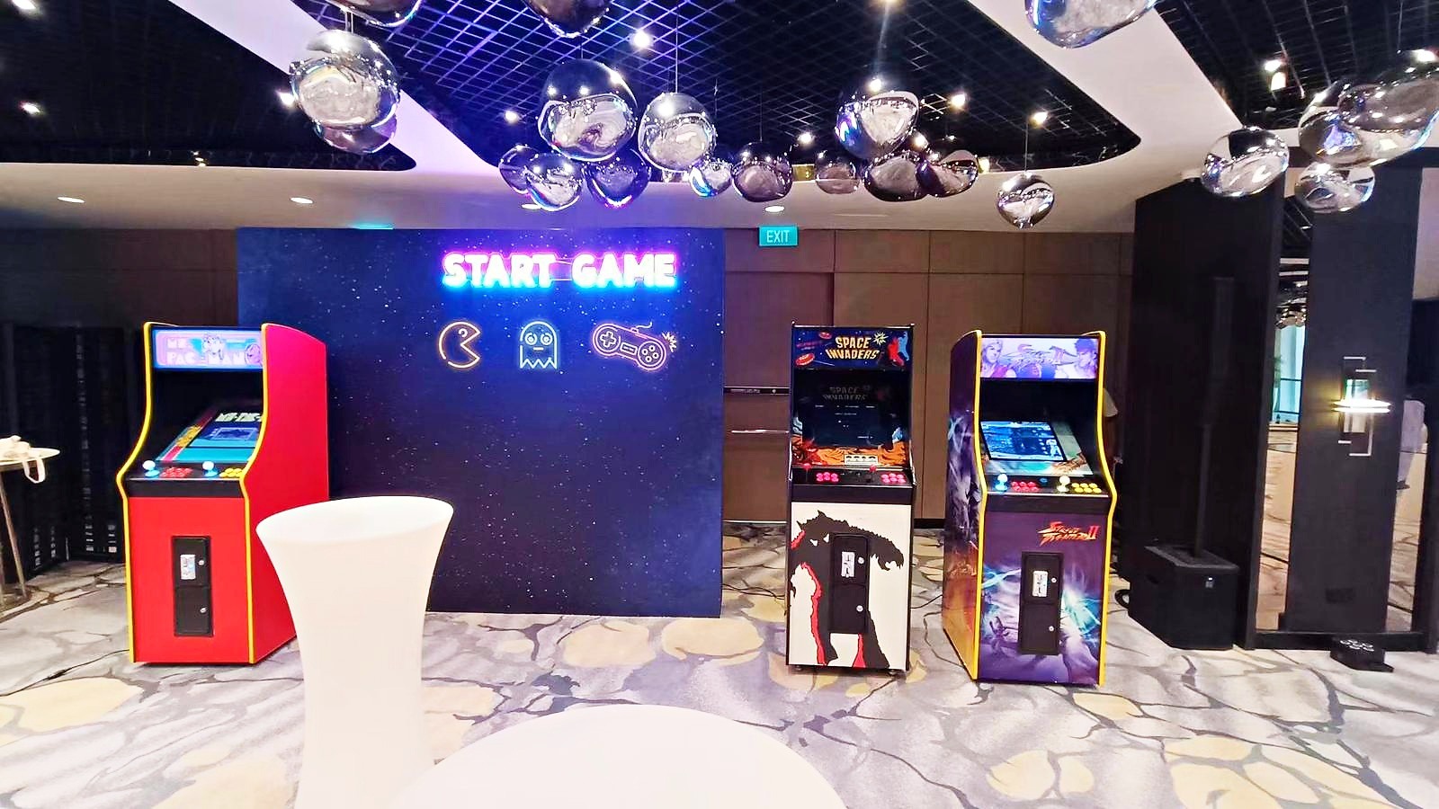 Company year end party in Singapore with a custom arcade lounge and themed decor
