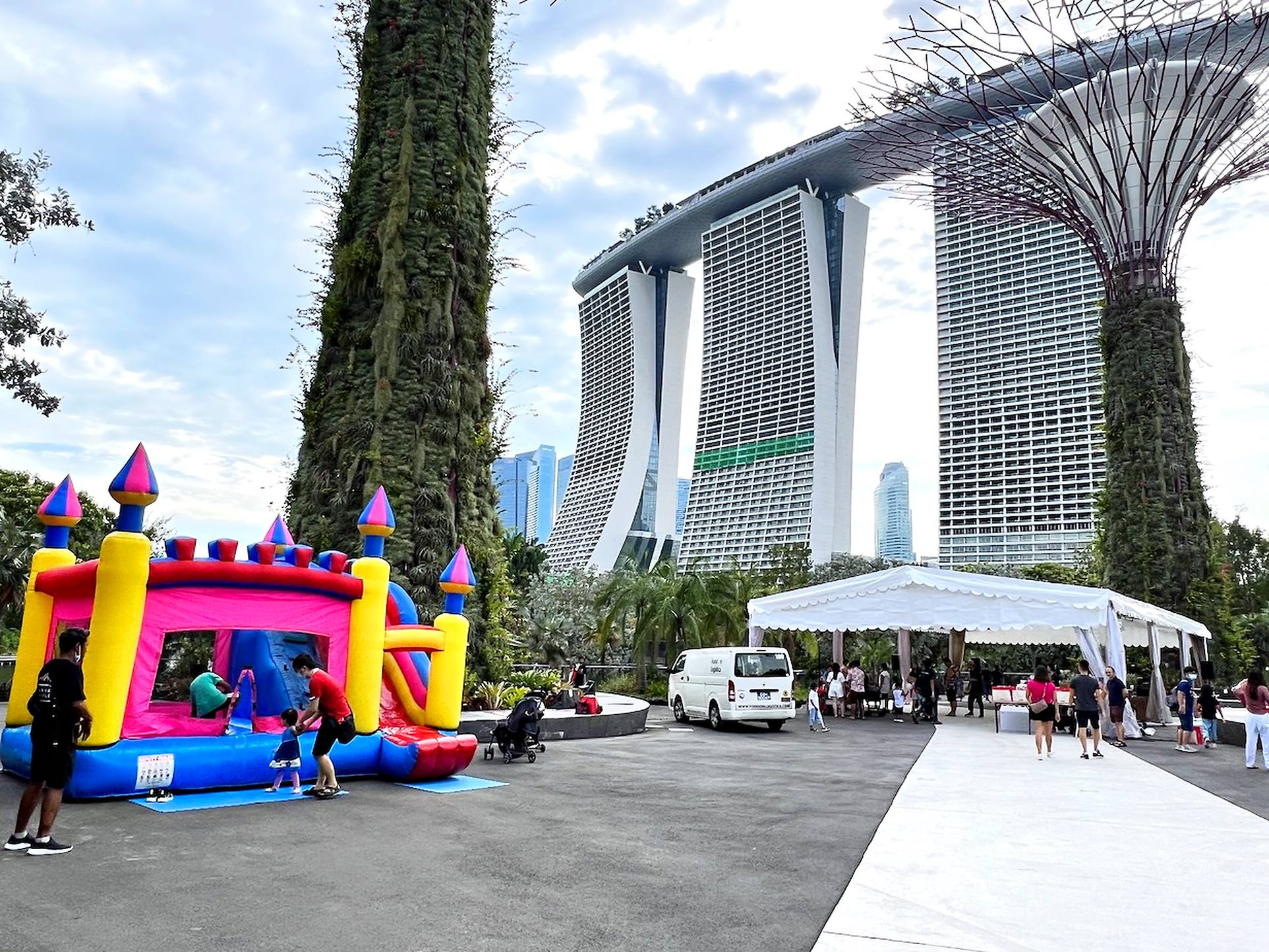 Family day layout with an inflatable play area and sheltered gathering space