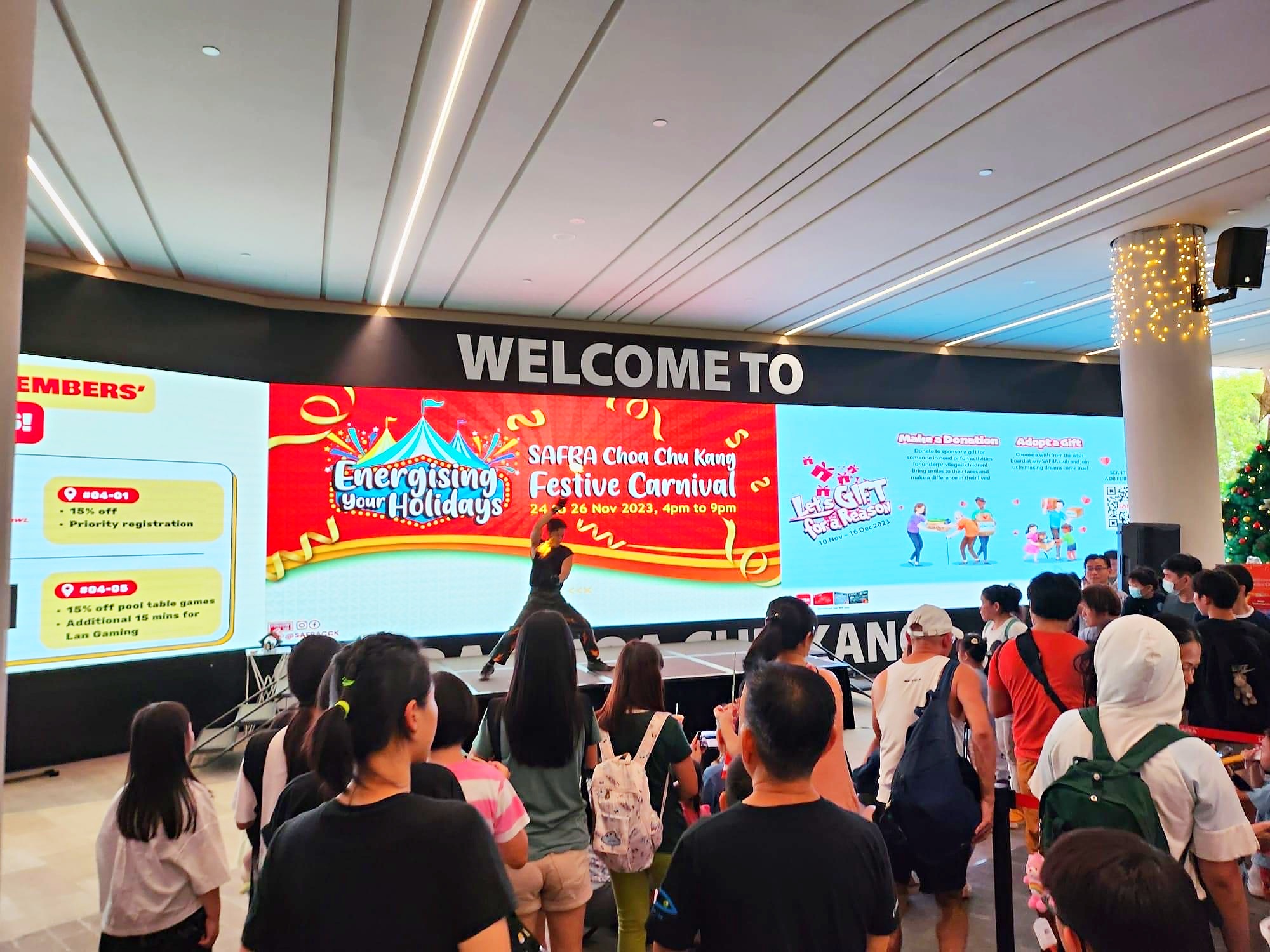 Audience watching a festive carnival stage in Singapore